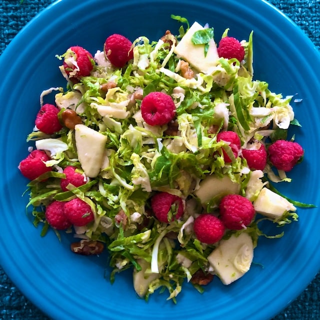 Shaved Brussels Sprout Salad with fruit, gorgonzola, and brown butter walnuts recipe